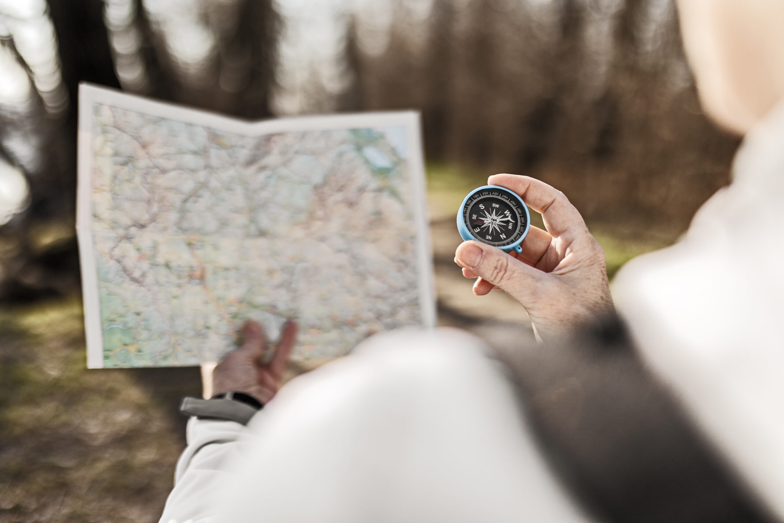 Senior women  in autumn forest enjoying in nature